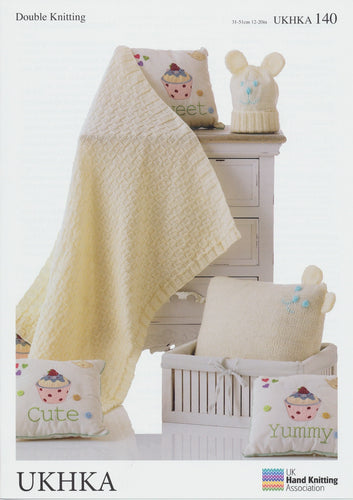 Double Knitting Pattern - Baby Banket, Cushion & Hat In Cream (UKHKA 140)